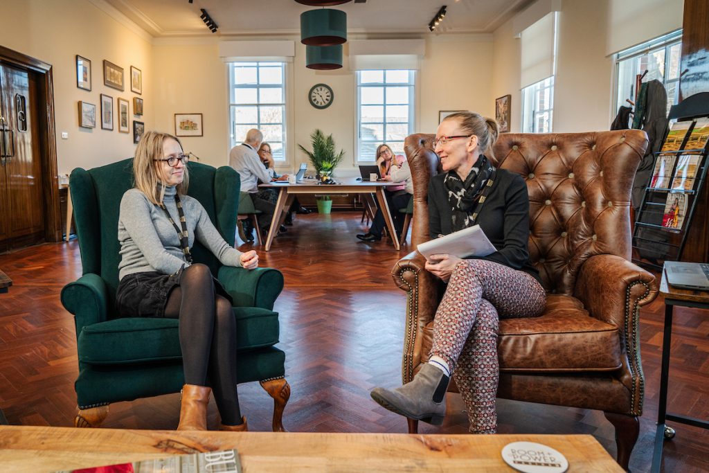 Colleagues using the chairs in the lounge at the co-working hub at Room and Power in Padiham